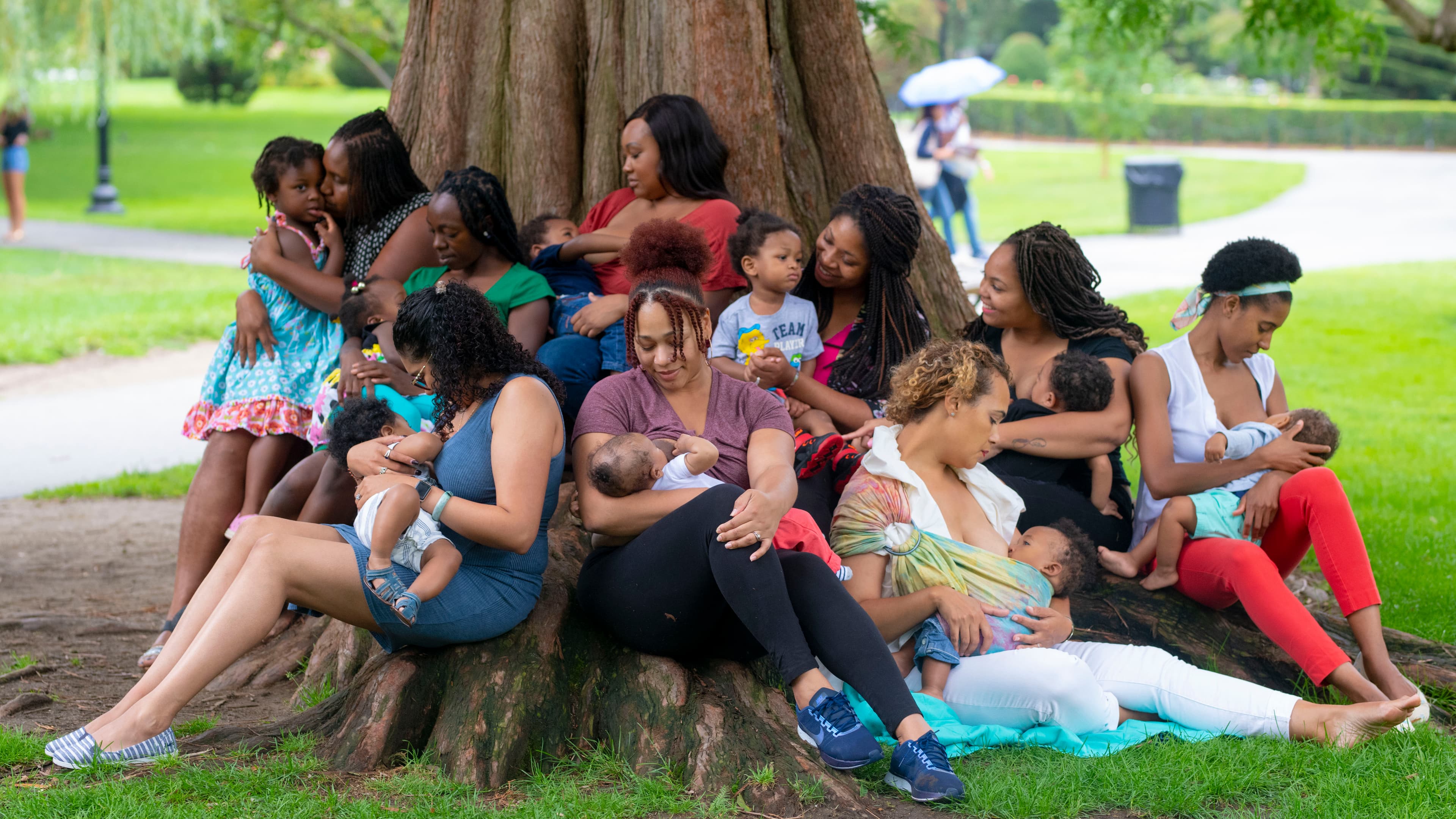 Mothers supporting breastfeeding in a park